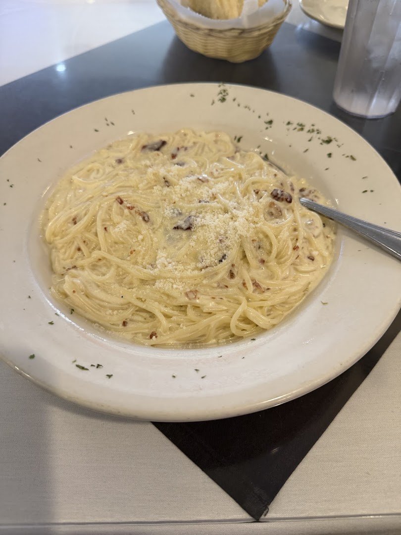 Set tables inside a relaxed pasta restaurant.